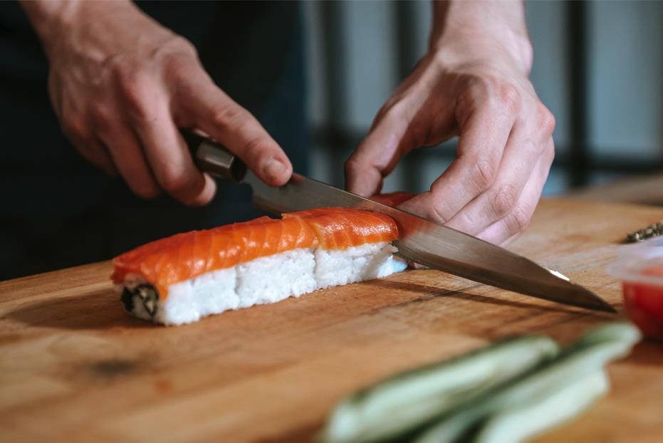 Single bevel knife cutting sushi 