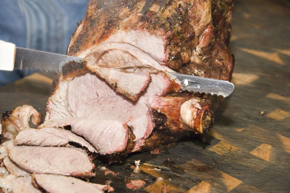 Cutting meat with bread knife 