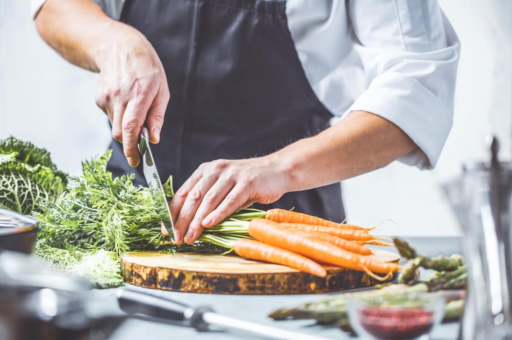 chef knife cutting veggies