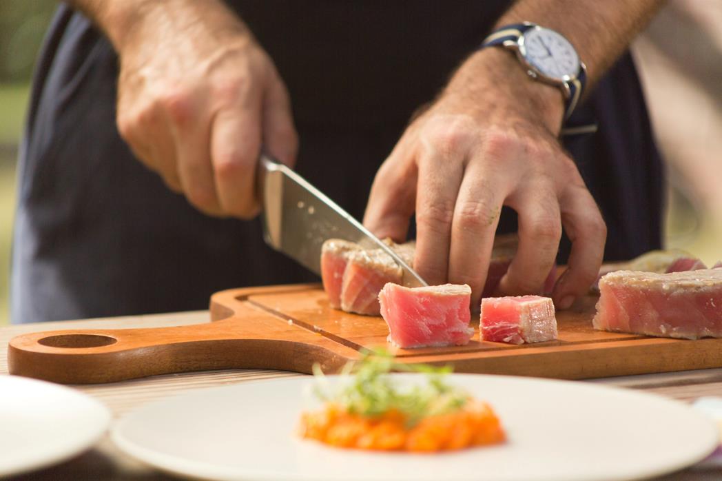 Chef knife cutting meat 