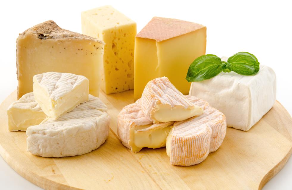 Cut cheese on cheeseboard 
