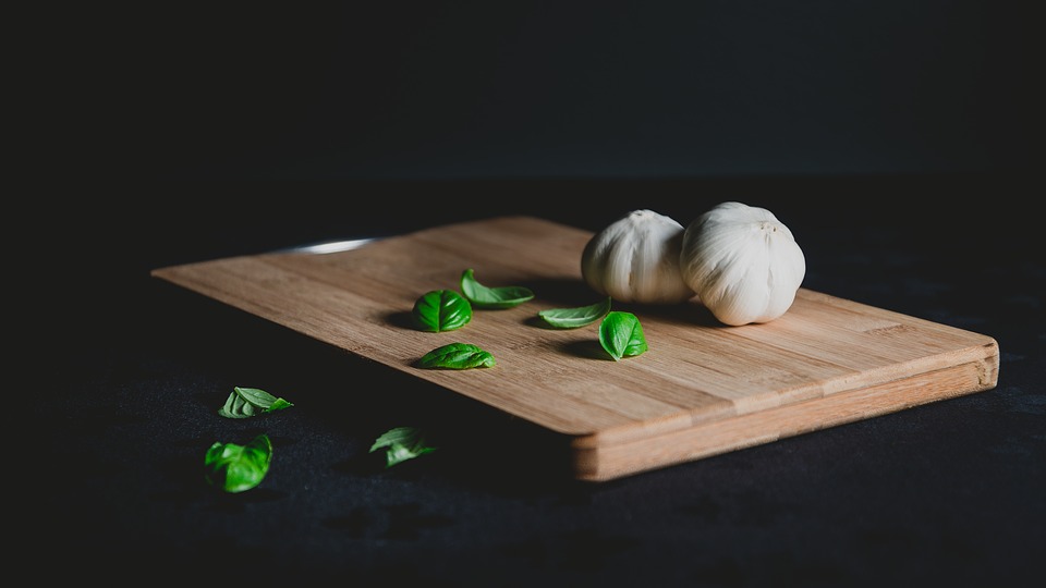 Cutting Board with Garlic and Basil Image