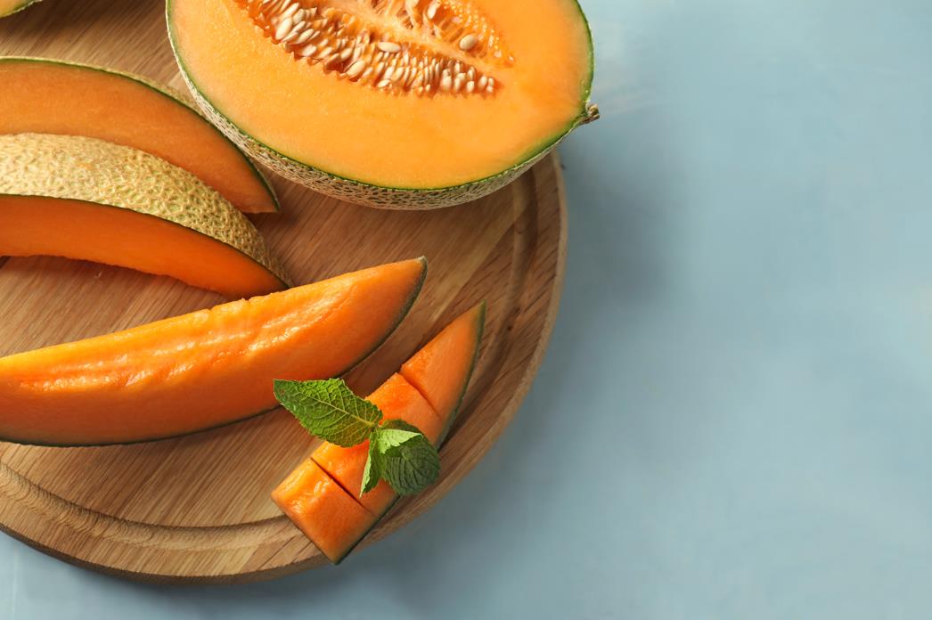 Cutting a cantaloupe into wedges