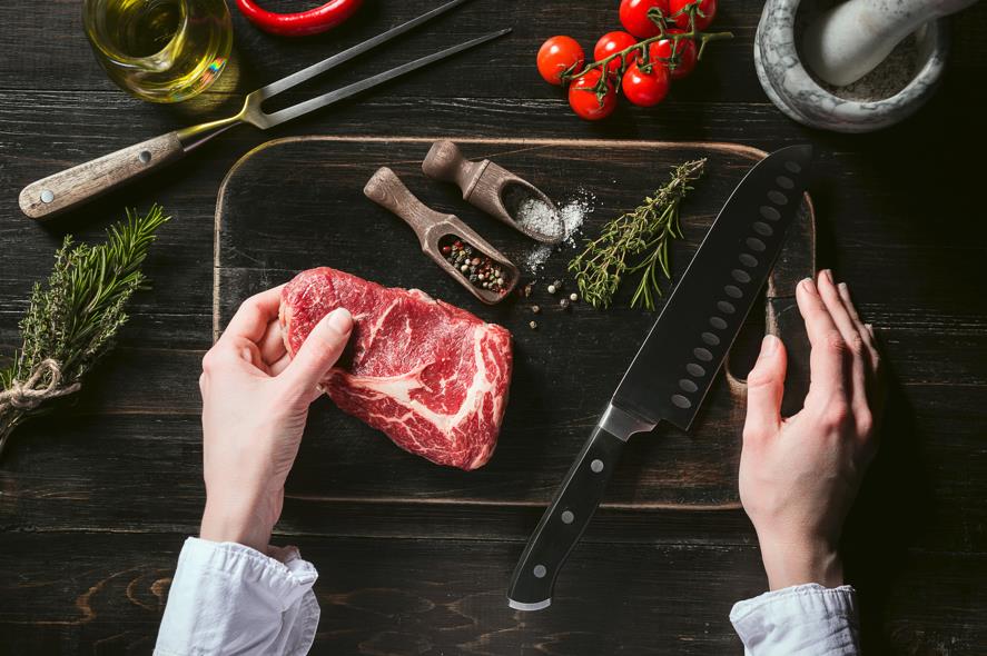 Cutting raw prime rib