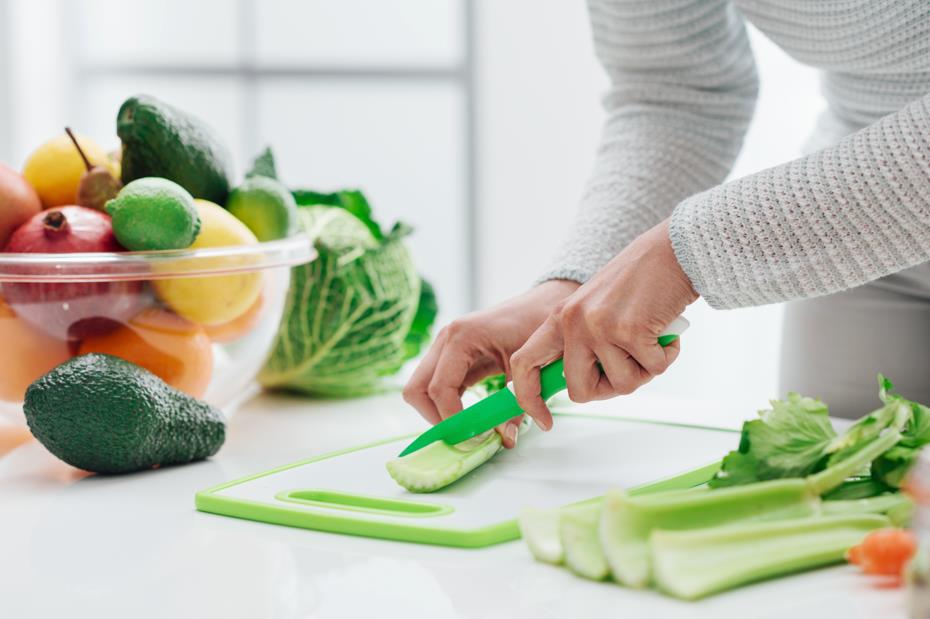 Cutting vegetables with utility knife 