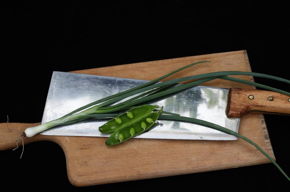 Chinese cleaver on a wooden cutting board