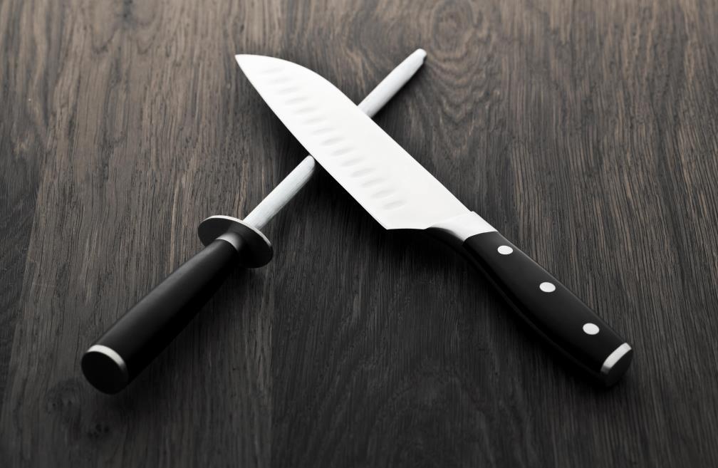 The picture of an honing rod and a santoku knife