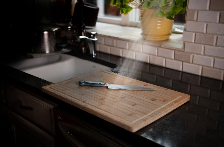 Knife and cutting board in kitchen
