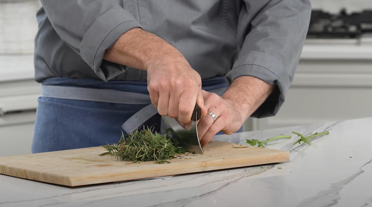 using a ulu knife to cut herbs