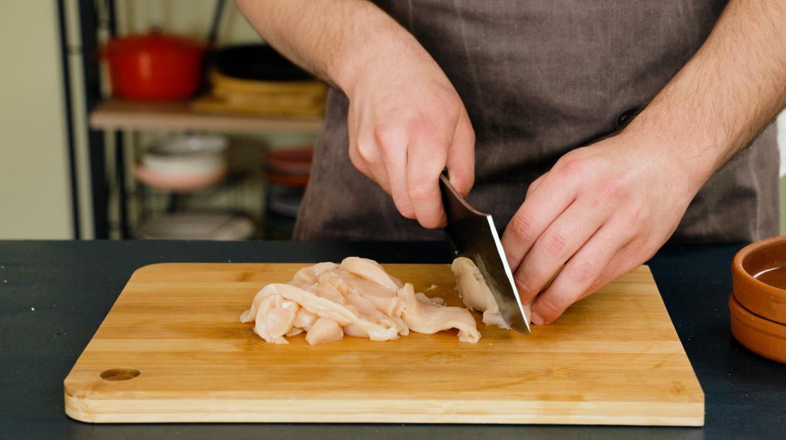 Cutting chicken breast into strips step 1