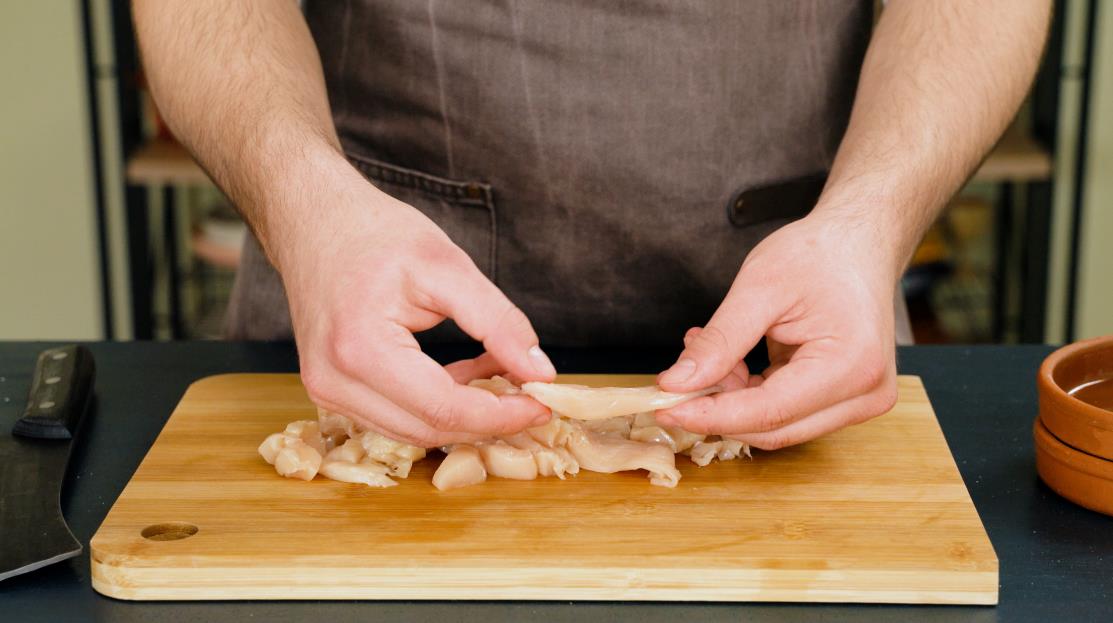 Cutting chicken breast into strips step 2