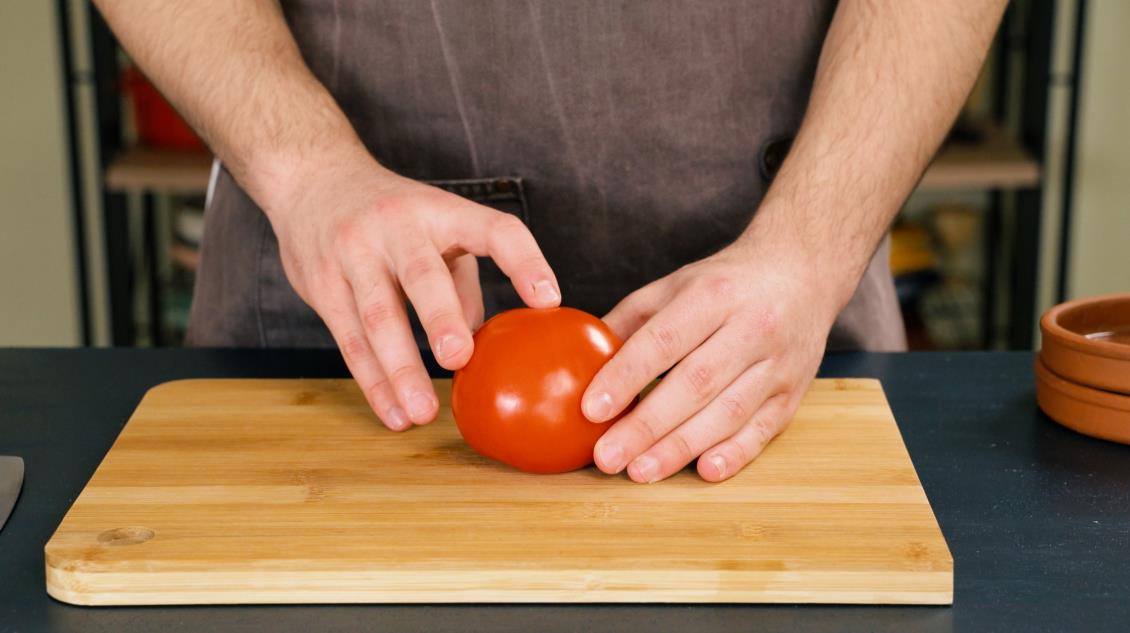 Step 1. Position the tomato on the cutting board