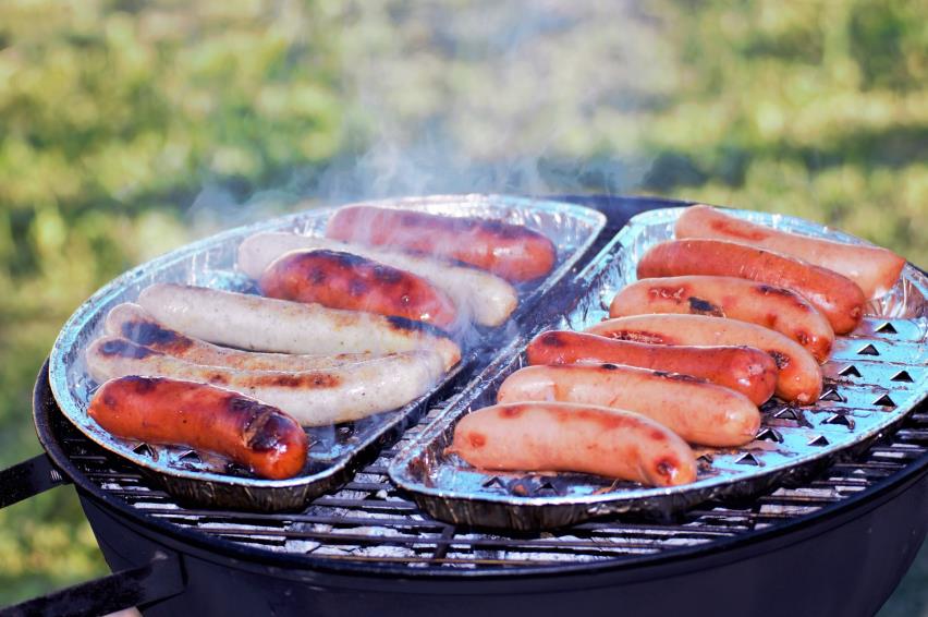 cooking meat outside on top of the grill