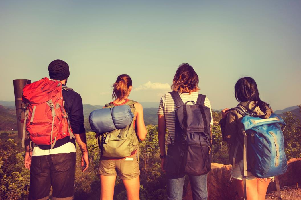 four backpackers looking afar