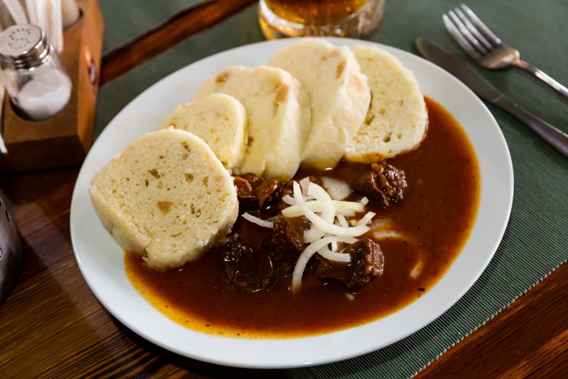 Tasty beef goulash with potato dumplings. Czech cuisine